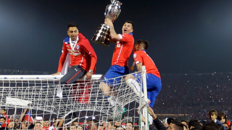 Chile's players, including Gary Medel (centre) celebrate following their penalty shootout win over Argentina in the final of Copa America &nbsp;at the National Stadium in Santiago on Saturday night<br />Picture: AP