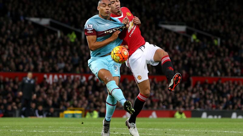 Manchester United's Chris Smalling and West Ham United's Winston Reid battle for the ball during Saturday's Barclays Premier League match at Old Trafford<br />Picture by PA&nbsp;