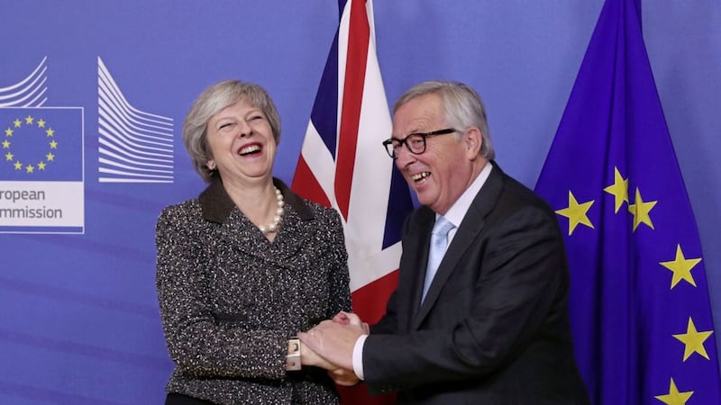 British prime minister Theresa May, left, is greeted by European Commission president Jean-Claude Juncker at EU headquarters in Brussels Picture by Francisco Seco/AP 