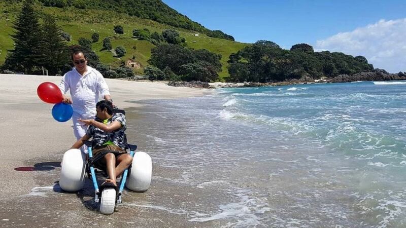 Teenager with cerebral palsy enjoys the ocean for the first time in years after special beach wheelchair gift