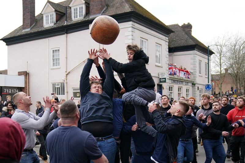 Players take part in the Atherstone Ball Game in Atherstone, Warwickshire, which honours a match played between Leicestershire and Warwickshire in 1199, when teams used a bag of gold as a bal