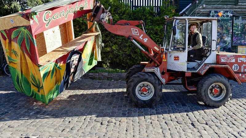 Residents of Christiania, uses a digger to remove the illegal hashish stalls in Pusher Street, Copenhagen PICTURE: Thomas Borberg/ AP via POLFOTO 