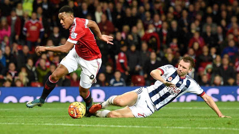 Manchester United's Anthony Martial is brought down by West Bromwich Albion's Gareth McAuley to win a late penalty at Old Trafford on Saturday<br />Picture: PA