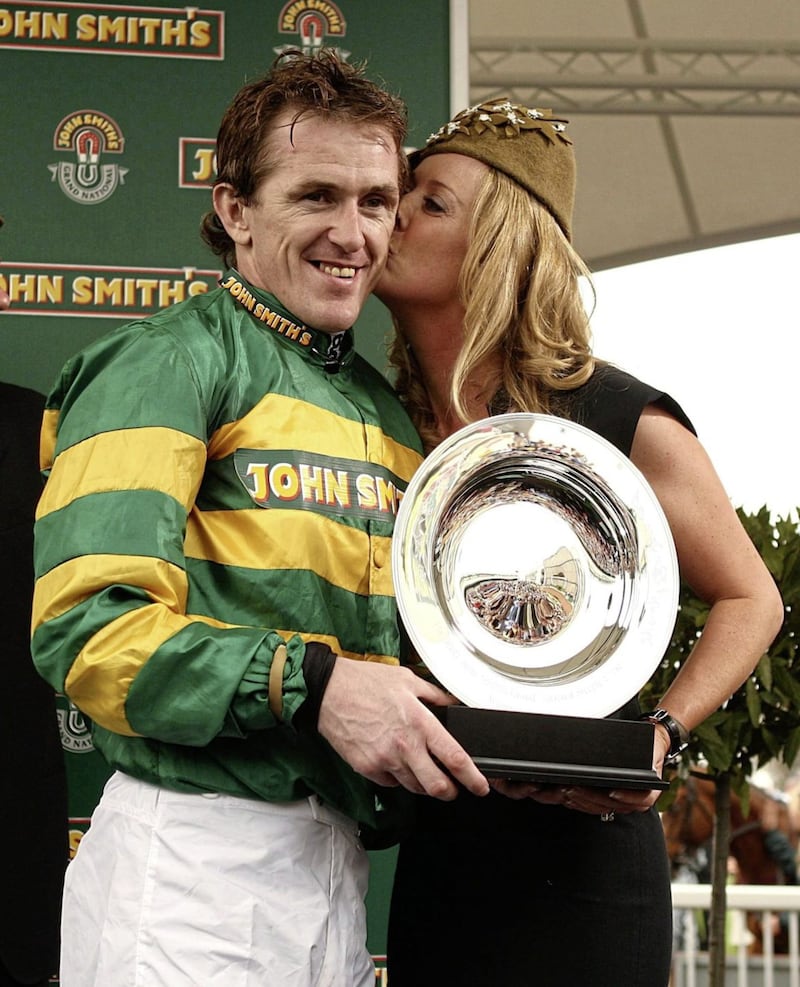AP McCoy is kissed by his wife Chanelle after his 2010 victory at the Aintree Grand National 