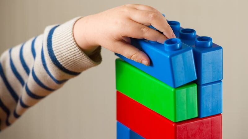 File photo dated 24/01/16 of a preschool age child playing with plastic building blocks. Nearly half of children are not developmentally ready for Reception, teachers have reported in a report from early years charity Kindred2.
