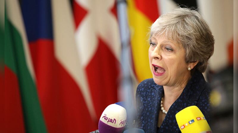 Theresa May speaking ahead of an EU summit in Brussels