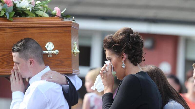 A sister of Jennifer Dornan at yesterday&#39;s funeral in west Belfast. Picture by Hugh Russell 