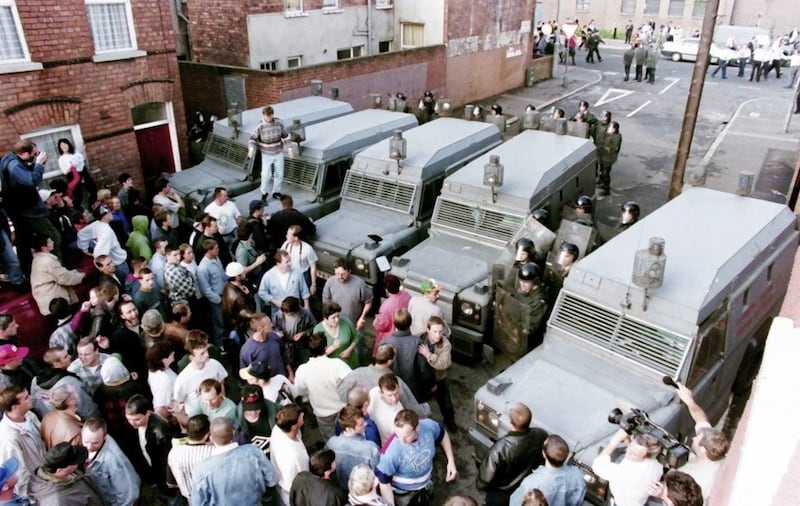 Nationalists in the Lower Ormeau area of Belfast hold a protest at RUC lines in 1995.