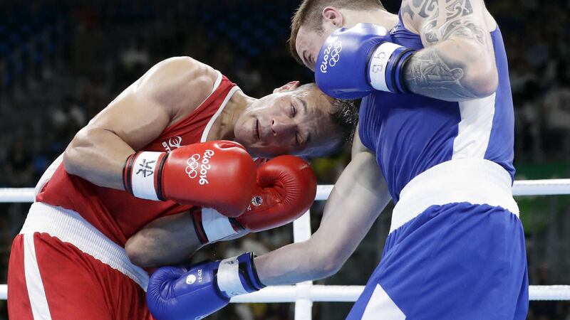Ireland's Steven Donnelly (left) drives a cracking right hand into the body of Algeria's Zohir Kedache during their welterweight clash at the 2016 Summer Olympics in Rio de Janeiro, Brazil