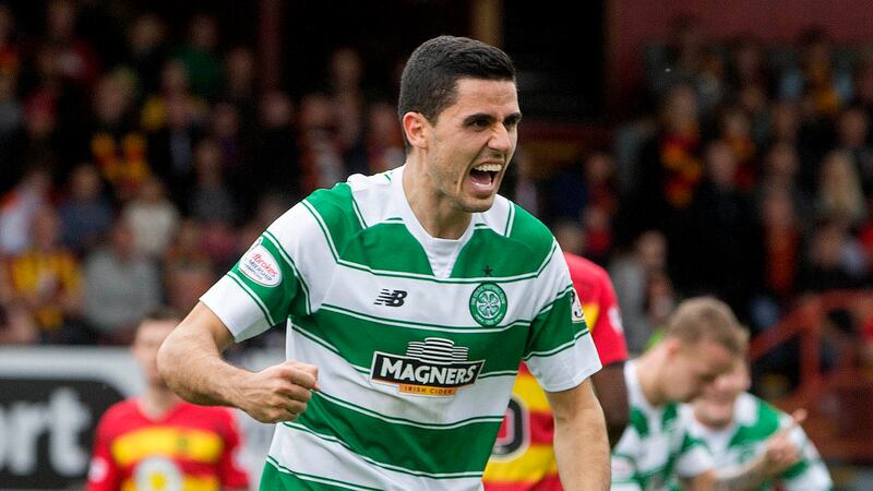 Celtic's Tom Rogic celebrates celebrates opening the scoring against Partick Thistle at the Firhill Stadium on Sunday<br />Picture: PA