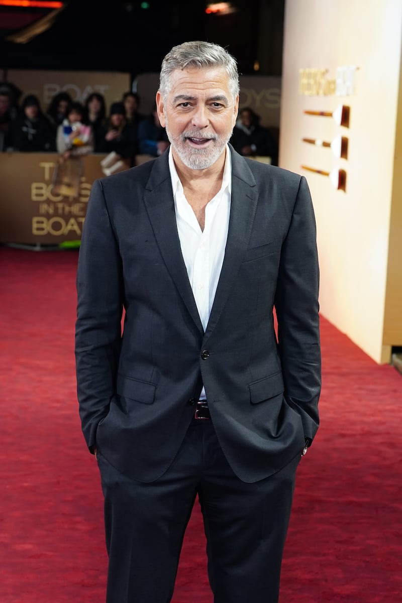 Actor and director George Clooney on the red carpet at a premiere of his film The Boys in the Boat