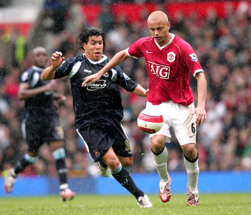 Manchester United's Wes Brown and West Ham United's Carlos Tevez (left) battle for the ball during the FA Barclays Premiership match at Old Trafford Manchester on Sunday May 13 2007