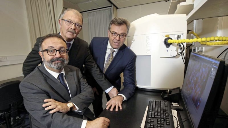 Alastair Hamilton (right), Invest NI, is pictured with Professor Manuel Salto-Tellez and Professor James McElnay from Queen&rsquo;s University Belfast at the new Precision Medicine centre 
