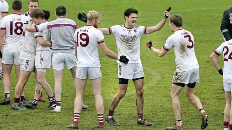 Slaughtneil&#39;s Chrissy McKaigue and Brendan Rogers celebrate after beating Magherafelt during the Derry Senior Football Championship Final at Bellaghy on Sunday. Picture by Margaret McLaughlin 