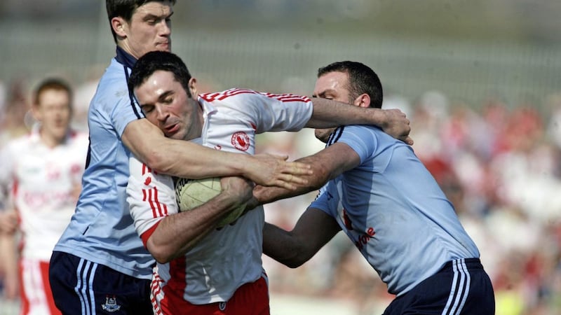 Tyrone's Ryan Mellon is put under pressure by Dublin duo Dermot Connolly and Paul Casey in the league meeting in Omagh in 2010.<br /> Pic Seamus Loughran
