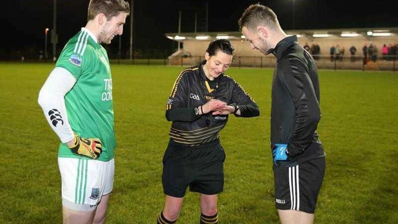 Maggie Farrelly gets formalities underway before refereeing the Dr McKenna Cup match between Fermanagh and St Mary's College&nbsp;