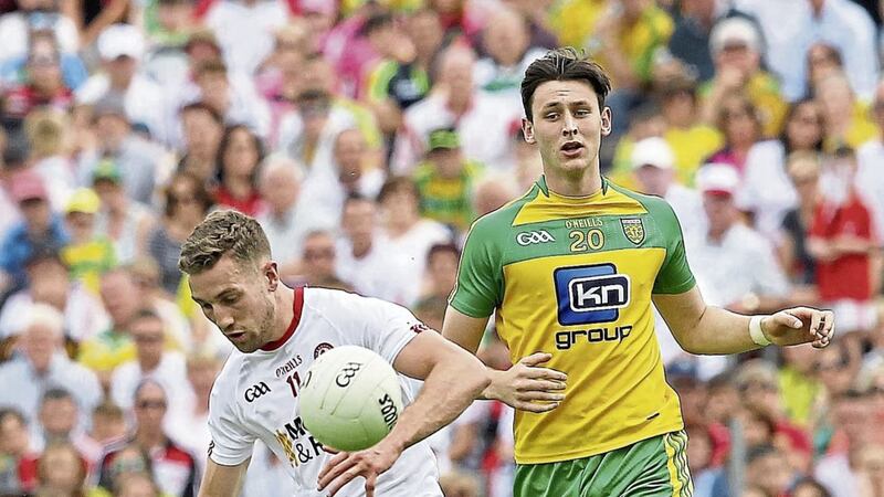 Tyrone&#39;s Niall Sludden comes under pressure from Donegal&#39;s Michael Langan in the 2017 Ulster Senior Football Championship semi-final. Picture by Philip Walsh. 
