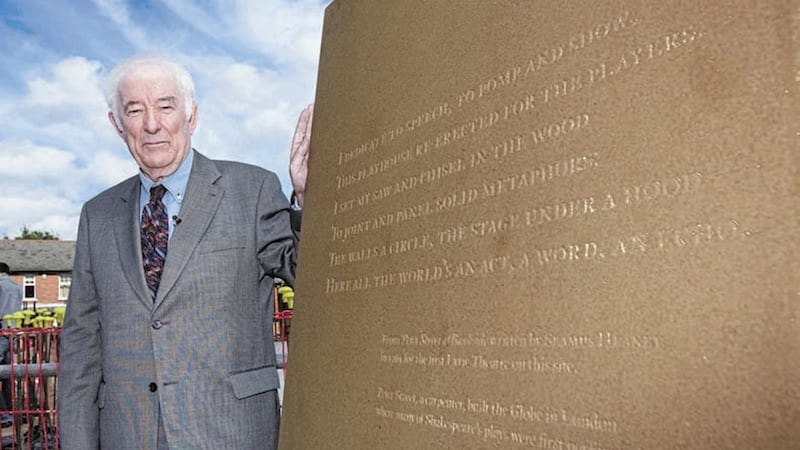 Seamus Heaney unveils a stone inscribed with words from one of his poems in September 2009. File picture by Cliff Donaldson 