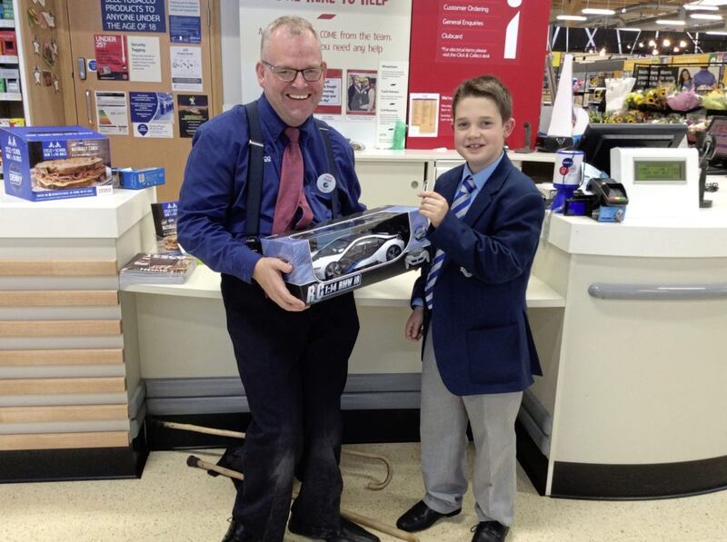 Kasper swapped his paperclip with David McKay, community manager, Tesco Extra Outlet, Banbridge for a remote toy car worth &pound;12 