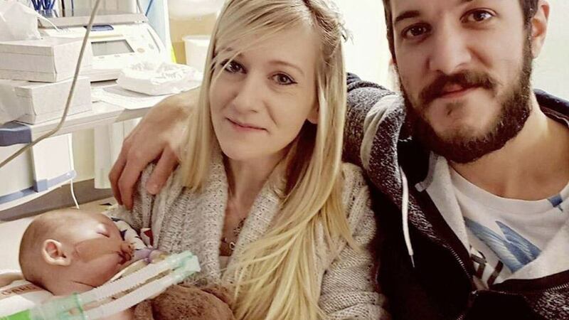 Connie Yates and Chris Gard with their son Charlie. The hospital treating Charlie Gard would consider any offers or new information relating to the &quot;wellbeing of a desperately ill child&quot;, Theresa May said. The Prime Minister's comments came after US president Donald Trump and the Pope tweeted their support for the boy, who has been at the centre of a lengthy legal battle involving his parents and doctors at Great Ormond Street Hospital (GOSH)<br />PICTURE: Connie Yates/Facebook/Charliegardsfight