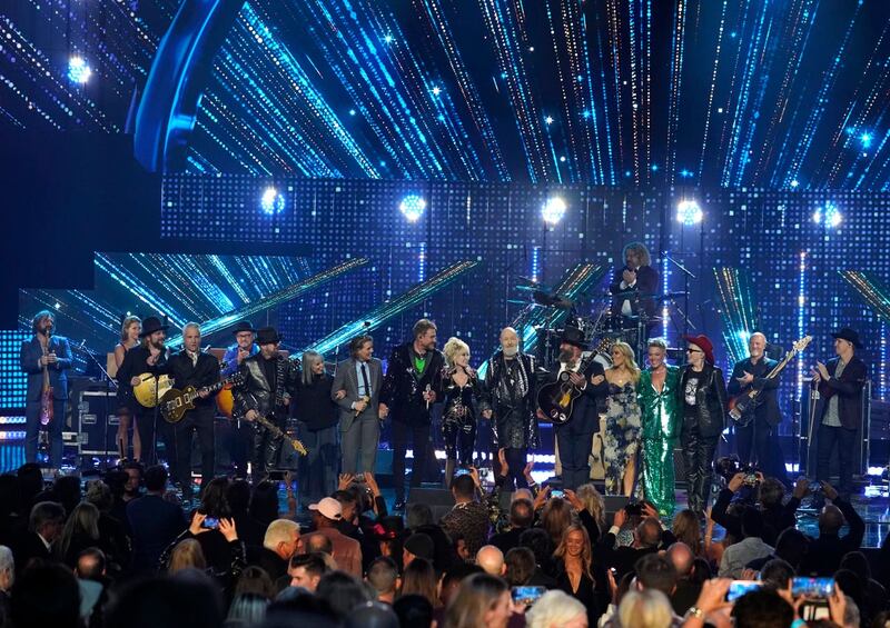 Neil Giraldo, from left, Dave Stewart, Pat Benatar, Brandi Carlile, Simon Le Bon, Dolly Parton, Rob Halford, Sheryl Crow, Pink, and Annie Lennox perform during the Rock & Roll Hall of Fame induction ceremony at the Microsoft Theatre in Los Angeles