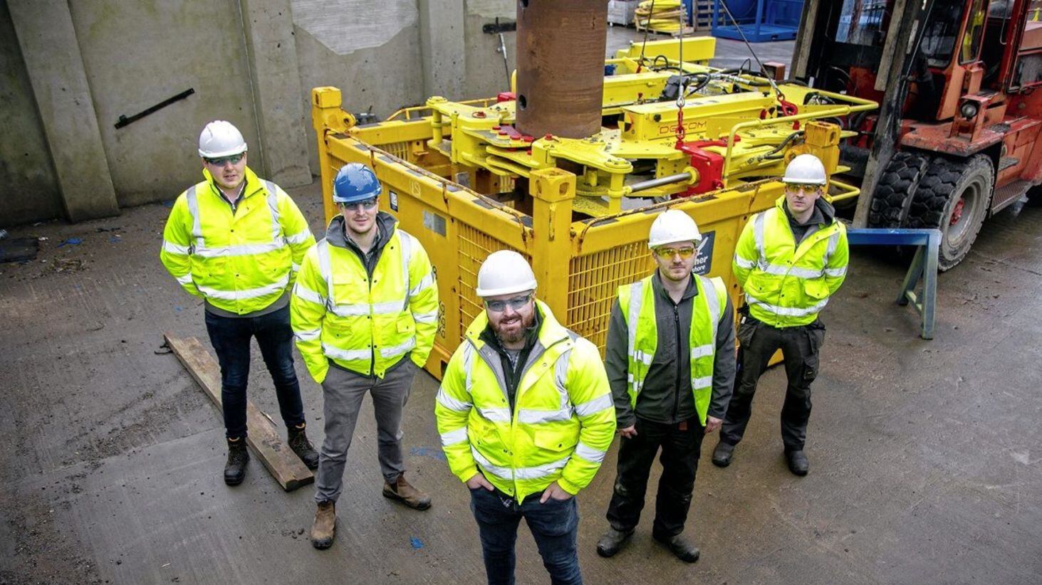 Managing director Sean Conway (centre) with his Decom Engineering team team during test trials.