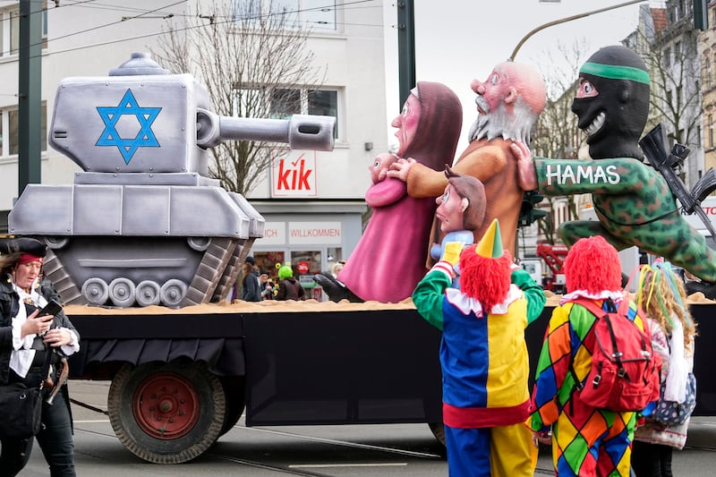 A float depicting an Israel tank, Palestinians and a Hamas militant joined the parade in Duesseldorf (AP Photo/Martin Meissner)