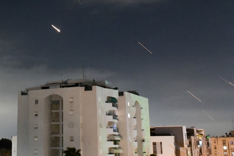 Israel’s Iron Dome air defence system intercepts missiles fired from Iran on Sunday (Tomer Neuberg/AP)