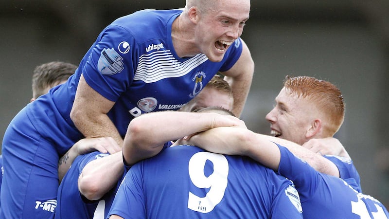Dungannon&rsquo;s Andrew Mitchell is congratulated by his team mates after grabbing his second against Cliftonville &nbsp;