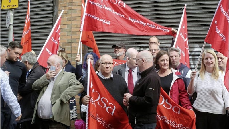 Workers protest in north Belfast after threats were issued against staff employed by PBNI. Picture by Hugh Russell. 