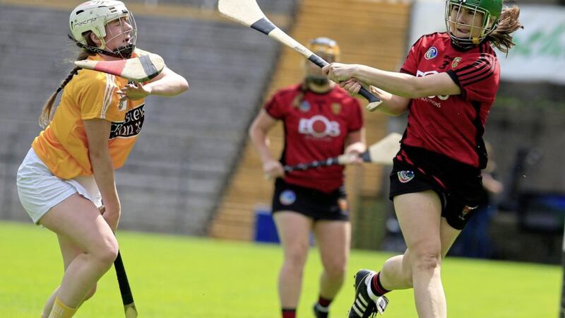 Antrim's Lucia McNaughton bravely challenges Down's Alannah Savage during the 2019 Ulster Camogie Senior Championship Final. <br />Picture by Philip Walsh