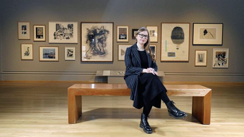 Anna Liesching, Curator of Art at Ulster Museum, pictured with artwork from Collage: A Political Act 