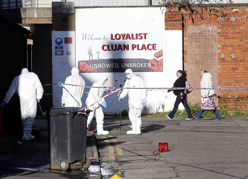 Forensic officers carry out a finger tip search of the murder scene in east Belfast. Picture by Mal McCann 