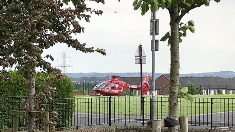 The Air Ambulance landed at playing fields in west Belfast after a boy became impaled on railings 