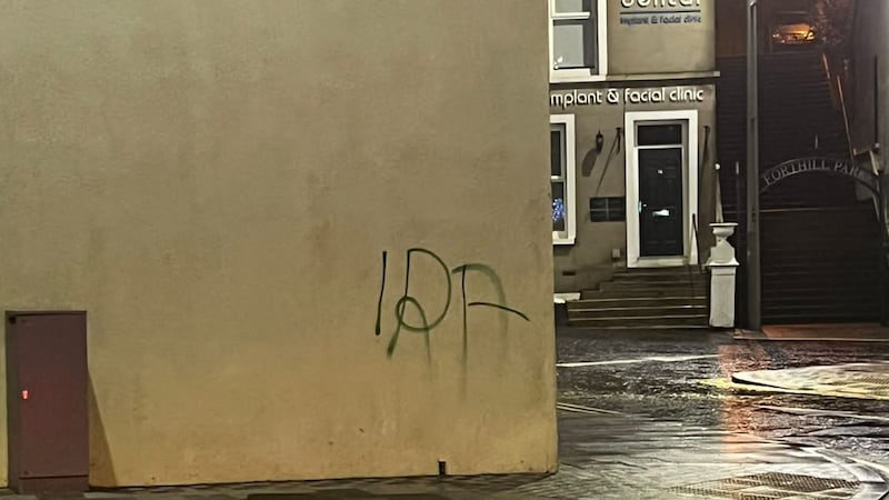 IRA graffiti in Enniskillen, Co Fermanagh, close to a memorial for the Enniskillen bomb (DUP/PA)