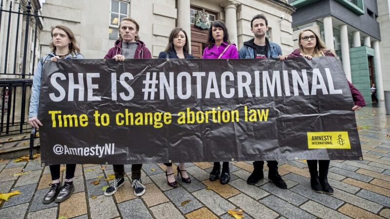 Solicitor Jemma Conlon (left centre) and Amnesty International Northern Ireland campaign manager, Grainne Teggart (right centre), with pro-choice campaigners 