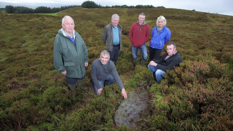 Francis Conway, Paul Holywood, Kieran Fox, Conor and Mary McGlinchey and Martin Haughey beside the Greencastle Mass Rock 