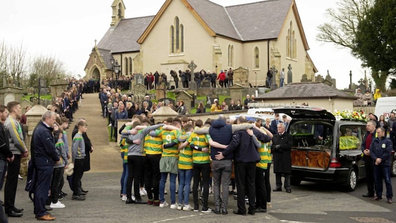 The funeral of Connor Currie takes place in the village of Edendork, Co Tyrone, in March 2019 