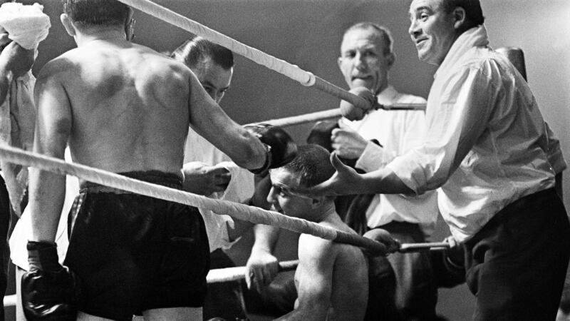The British and Commonwealth (British Empire) bantamweight title fight at the King's Hall, Belfast on October 20 1962, between Freddie Gilroy and John Caldwell comes to a premature end when Caldwell is forced to retire due to a severe cut over his right eye