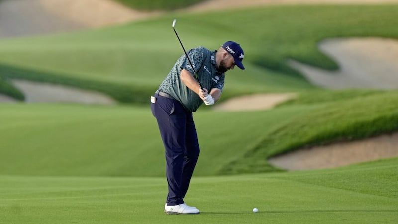 Shane Lowry plays a ball on the 12th fairway during the first round of Abu Dhabi HSBC Golf Championship 