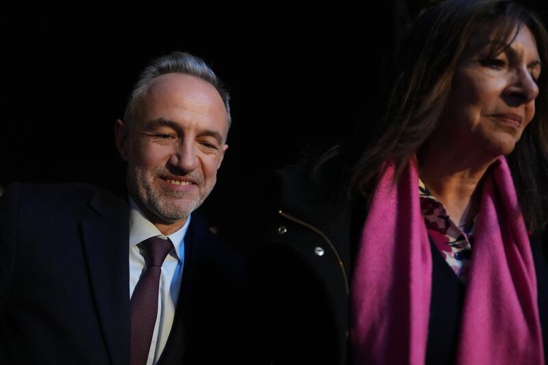 Anne Hidalgo greeted her successor in the French capital (AP)