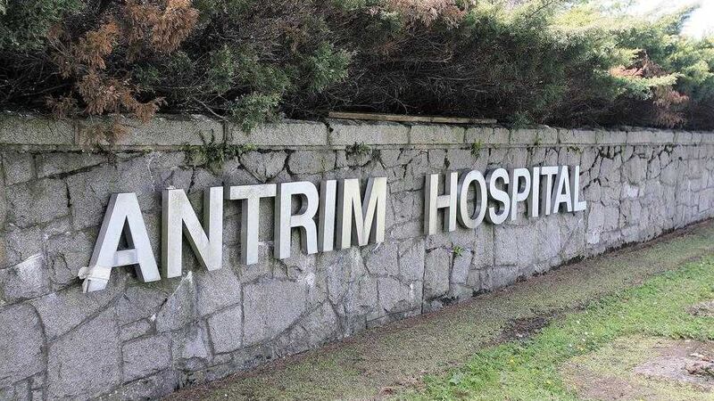 Health trusts have agreed not to transfer a brain injury victim to Antrim Area Hospital before a full legal challenge is heard 