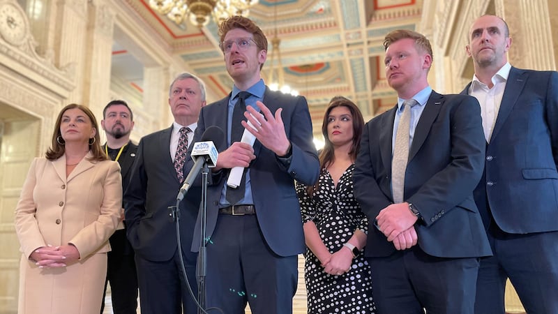 The SDLP's Matthew O'Toole (centre) speaks to media in the Great Hall at Parliament Buildings ahead of the Assembly's second Opposition Day