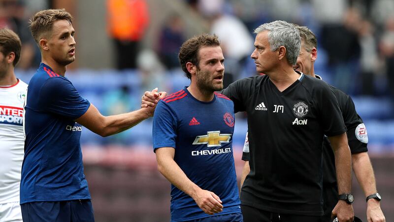 Manchester United's Adnan Januzaj (left) and Juan Mata with manager Jose Mourinho after the pre-season friendly match at the DW Stadium, Wigan&nbsp;