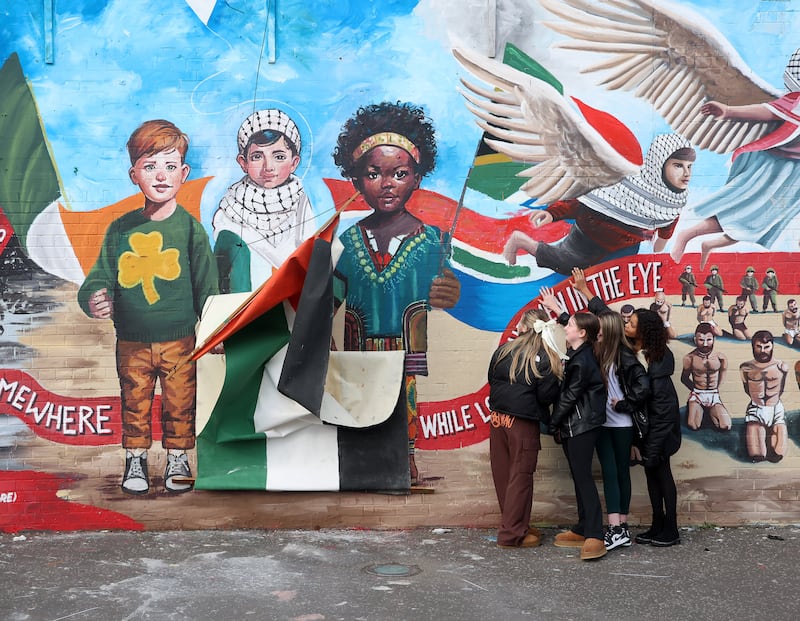 Mural based on images sent by Palestinians was unveiled at the International Wall on the Falls road