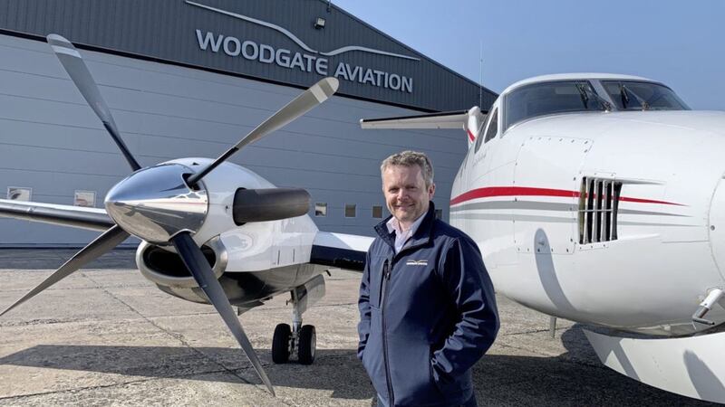 Woodgate Aviation&rsquo;s head of training Captain Simon Atkins beside the NI Air Ambulance at the company&rsquo;s purpose-built hangar 
