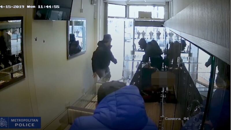 Three men ransacked the cabinets and one attacked a member of female staff when they robbed the shop in Haringay, north London, in April last year. 