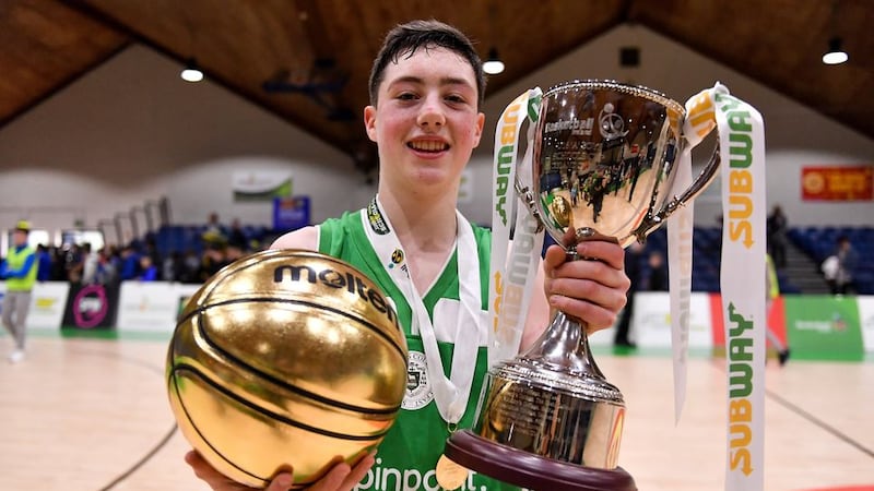 St Malachy's, Belfast basketball captain CJ Fulton with the winner's trophies after their All-Ireland U16 title success in Dublin