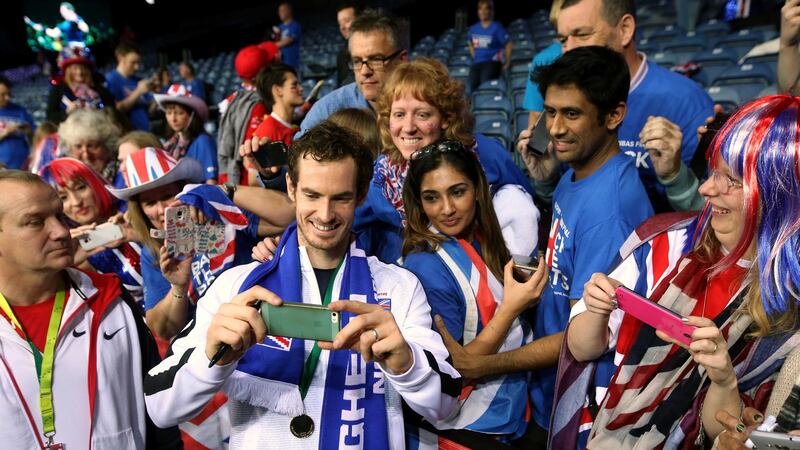 Andy Murray, pictured celebrating with fans, spearheaded Great Britain's first Davis Cup win in 79 years