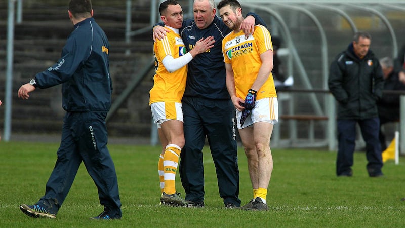 <span style="font-family: Arial, sans-serif; ">Antrim joint-manager Frank Fitzsimons celebrates with Conor Murray and Brian Neeson after Sunday's win in Aughrim <br />Picture by Seamus Loughran</span>